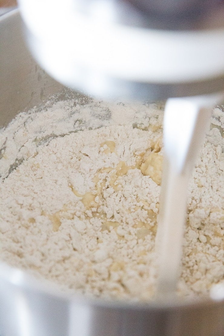 Beat the eggs into the yeast mixture, then add the flour