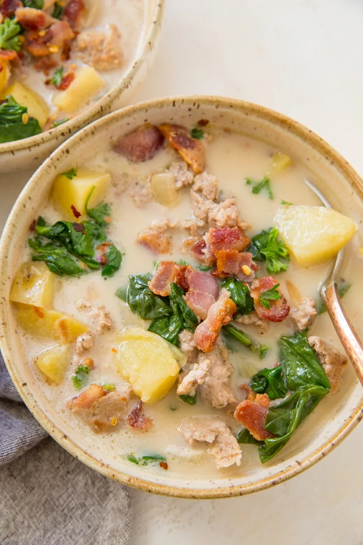 Healthy Zuppa Toscana made dairy-free, gluten-free, paleo and whole30. A delicious, filling healthy soup recipe with Italian sausage, potatoes, bacon, kale, and more!