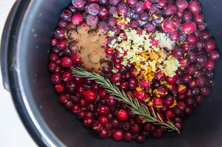 Easy Instant Pot Cranberry Sauce Recipe - with rosemary, ginger, orange zest, and pure maple syrup. A delicious and healthy cranberry sauce recipe