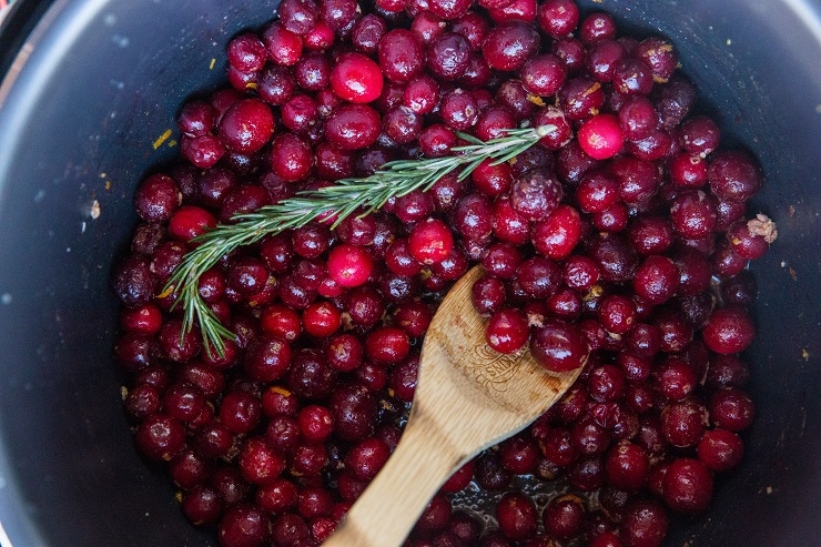 Stir the ingredients for the cranberry sauce