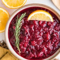 Instant Pot Cranberry Sauce - sweetened with pure maple syrup! This easy cranberry sauce recipe includes rosemary and orange zest for a delicious sauce.