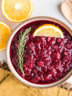 Instant Pot Cranberry Sauce - sweetened with pure maple syrup! This easy cranberry sauce recipe includes rosemary and orange zest for a delicious sauce.