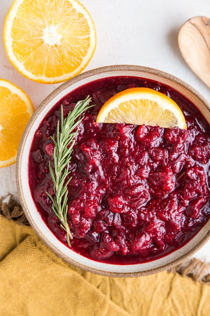 Instant Pot Cranberry Sauce - sweetened with pure maple syrup! This easy cranberry sauce recipe includes rosemary and orange zest for a delicious sauce.