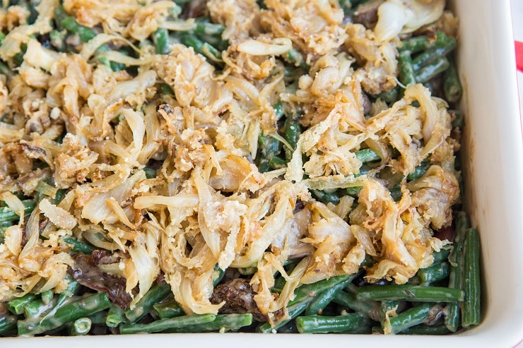 Spread the caramelized onion topping over the green beans and bake
