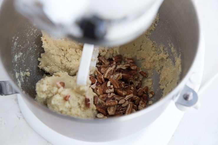 Add the chopped pecans to the cookie dough