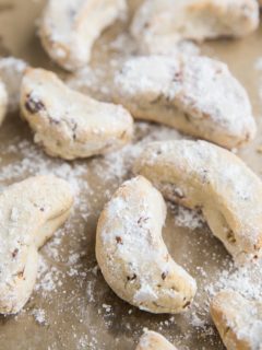 Paleo Mexican Wedding Cookies are egg-free, grain-free, refined sugar-free and can easily be made vegan. These festive cookies are marvelous additions to any holiday gathering or cookie exchange.