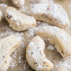 Paleo Mexican Wedding Cookies are egg-free, grain-free, refined sugar-free and can easily be made vegan. These festive cookies are marvelous additions to any holiday gathering or cookie exchange.
