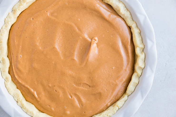 Transfer sweet potato pie filling to the prepared crust and smooth into an even layer
