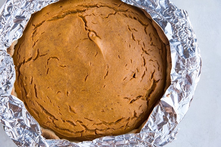 sweet potato pie with foil around the edges to protect pie crust