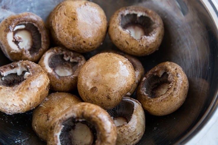 Remove the stems from the mushrooms and coat with oil and sea salt.