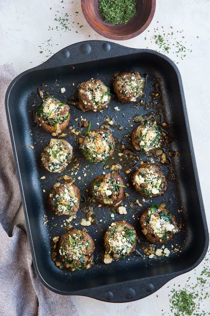 Ground Beef and Feta Stuffed Mushrooms with spinach, caramelized onion and garlic. A simply yet wildly flavorful appetizer!