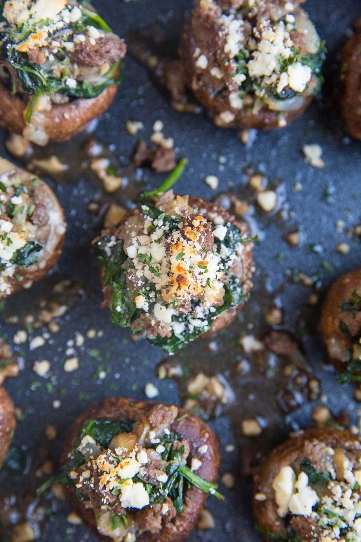 Ground Beef & Feta Stuffed Mushrooms with caramelized onion, garlic, and spinach makes for the perfect bite! This simple yet powerfully flavorful appetizer recipe is a winner for any gathering!
