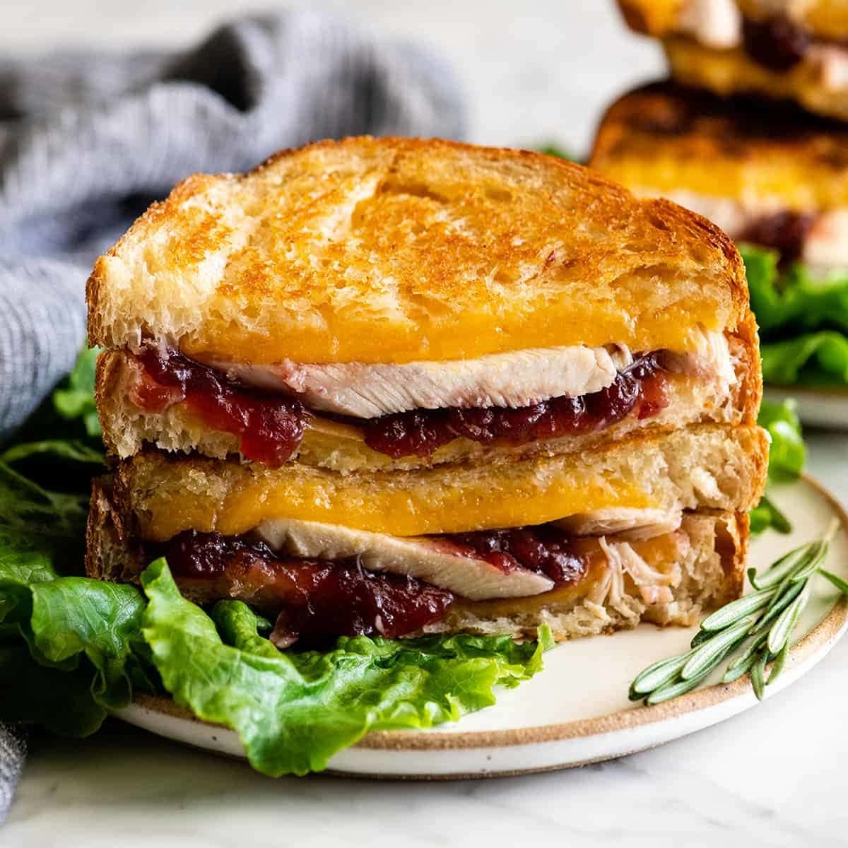 Leftover Turkey Cranberry Sandwich In this Turkey Cranberry Sandwich recipe turkey and cranberry sauce are nestled between two slices of buttery bread that have been grilled to perfection, all held together by melted cheddar cheese. This Thanksgiving sandwich is the perfect way to use up leftover turkey!  