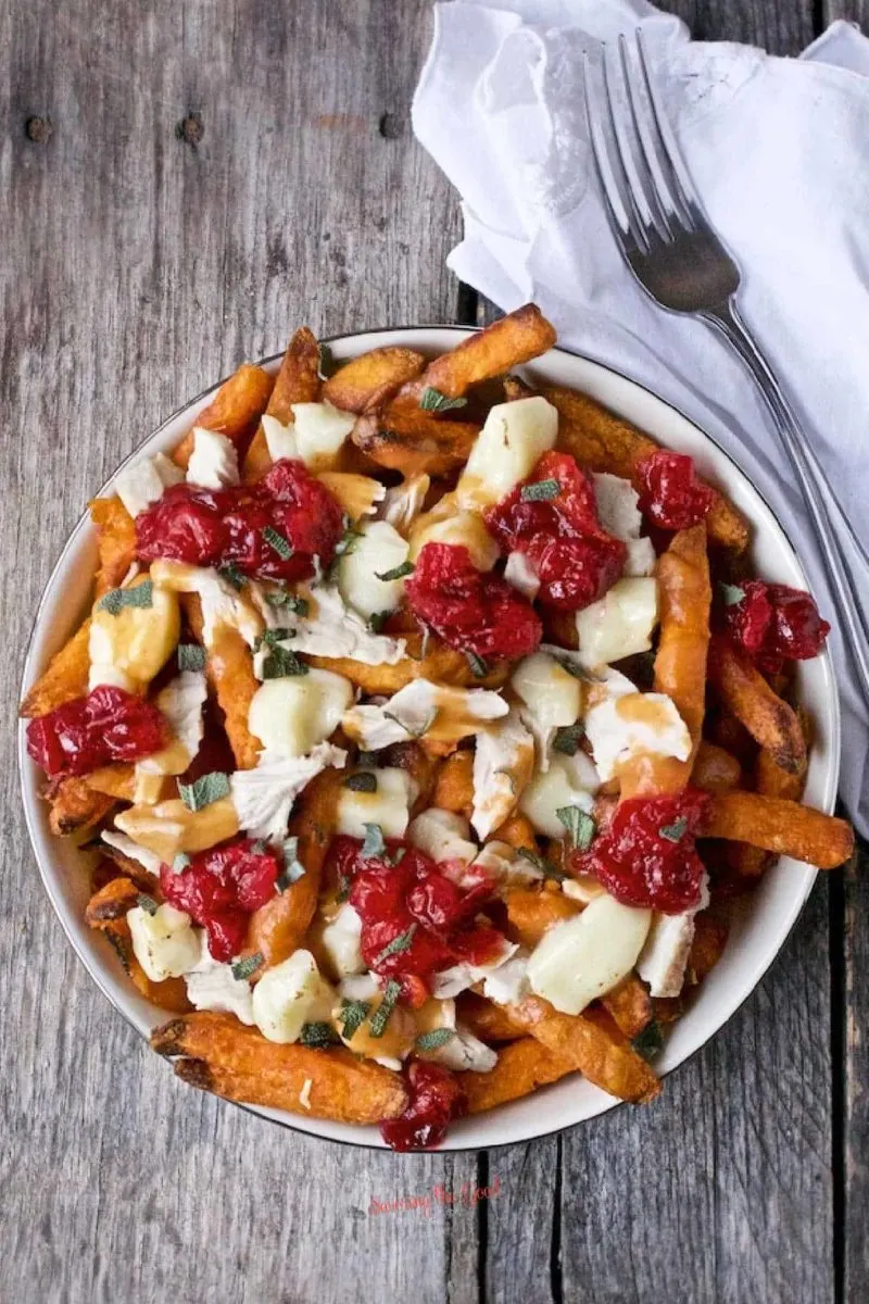 Turkey Poutine from Savoring the Good - Use leftover turkey, gravy, and cranberry sauce as a way to load up your sweet potato fries for an incredible meal.