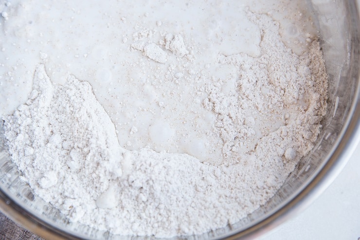 Pour in the coconut milk and stir well until a thick dough forms