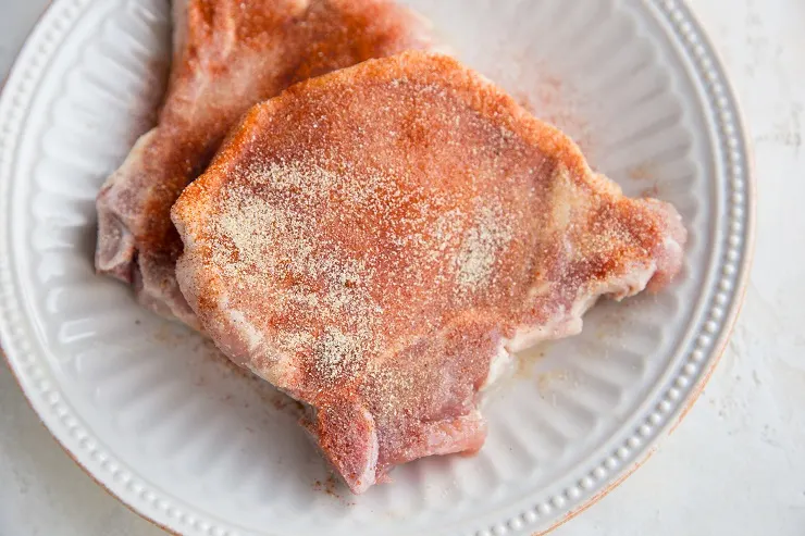 Sprinkle the pork chops with seasonings