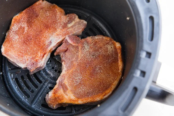 Place the pork chops in the air fryer