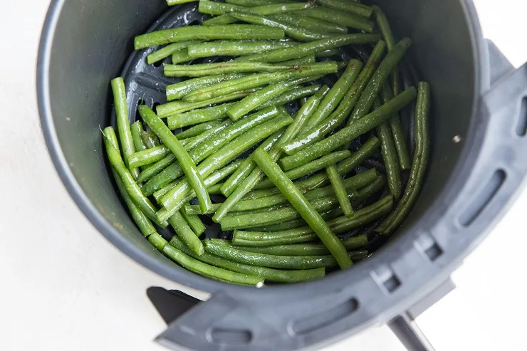 Toss the green beans in olive oil, sea salt, and garlic powder