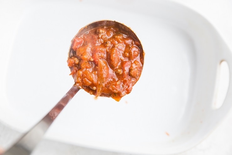 Add about 1 cup of sauce to the bottom of a casserole dish