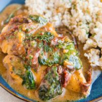 Instant Pot Creamy Tuscan Chicken with sun-dried tomatoes and spinach. A healthy flavorful easy dinner recipe.