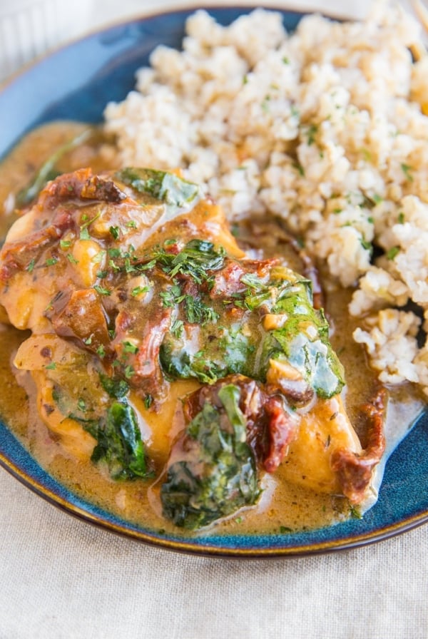 Instant Pot Creamy Tuscan Chicken with sun-dried tomatoes and spinach. A healthy flavorful easy dinner recipe.