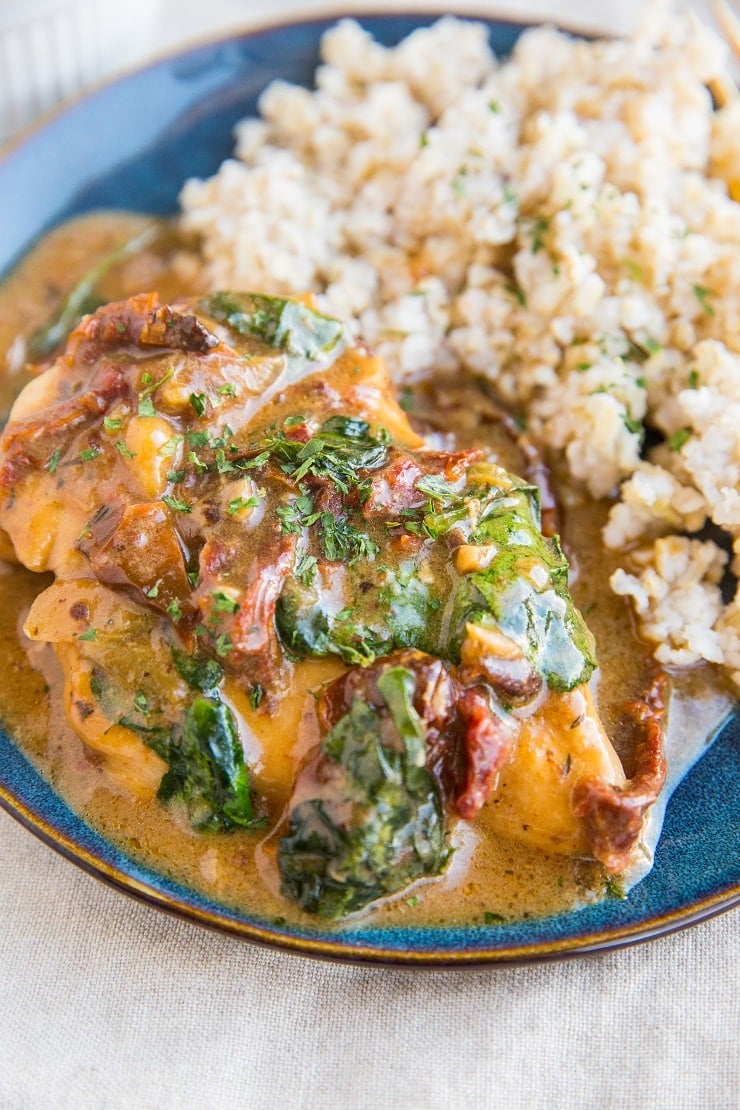 Instant Pot Creamy Tuscan Chicken with sun-dried tomatoes and spinach. A healthy flavorful easy dinner recipe.