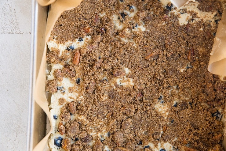 Sprinkle half of the streusel topping over the first layer of cake batter