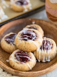 Keto Raspberry Thumbprint Cookies (Vegan, dairy-free, grain-free, egg-free) - these easy thumbprint cookies are a lovely gluten-free Christmas dessert!