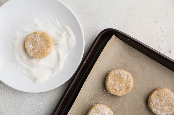 Form disc shapes out of the dough and coat in granulated sweetener