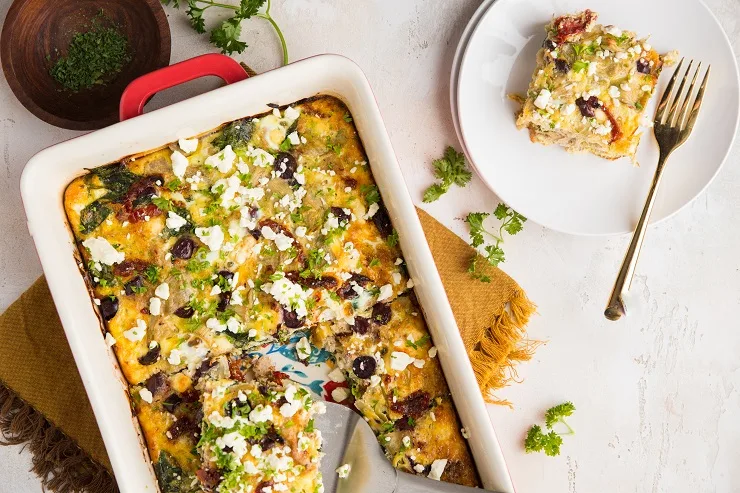 Greek Sausage Breakfast Casserole with Feta and Spinach, sun-dried tomatoes, kalamata olives, and artichoke hearts make this breakfast casserole so flavorful and inviting!