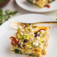 Greek Breakfast Casserole with sausage, sun-dried tomatoes, kalamata olives, feta cheese, spinach, and artichoke hearts. A wildly flavorful low-carb breakfast!