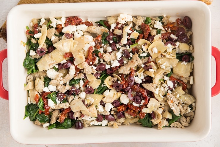 Add the sun-dried tomatoes, kalamata olives, artichoke hearts and feta cheese