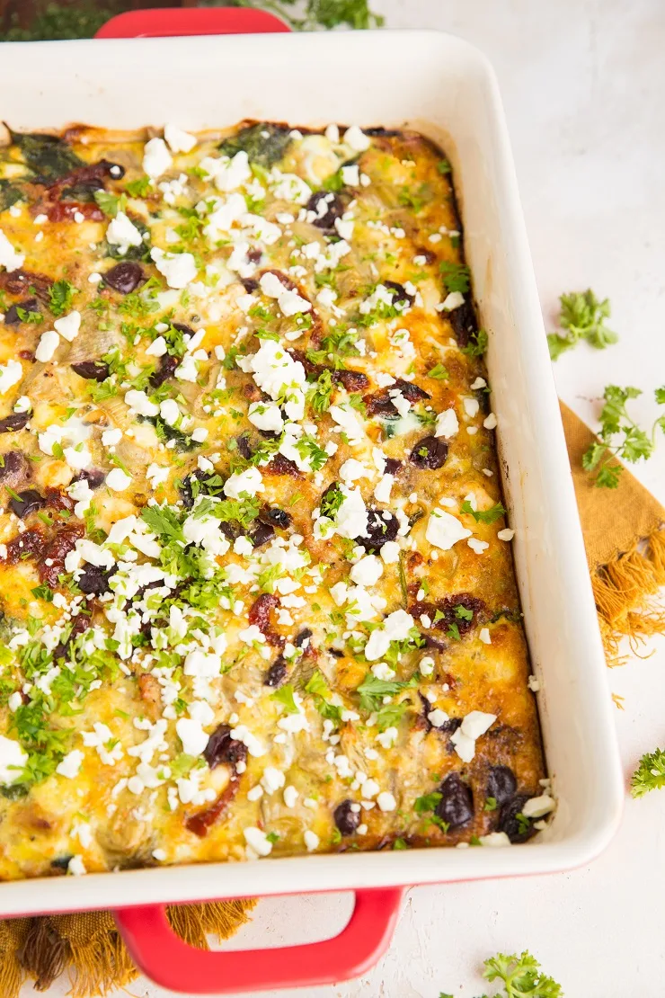 Easy Breakfast Casserole with sausage, sun-dried tomatoes, kalamata olives, spinach, feta, and artichoke hearts for a Greek style keto breakfast