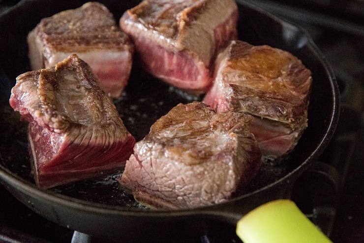 Brown the short ribs on two sides for 2 to 3 minutes.