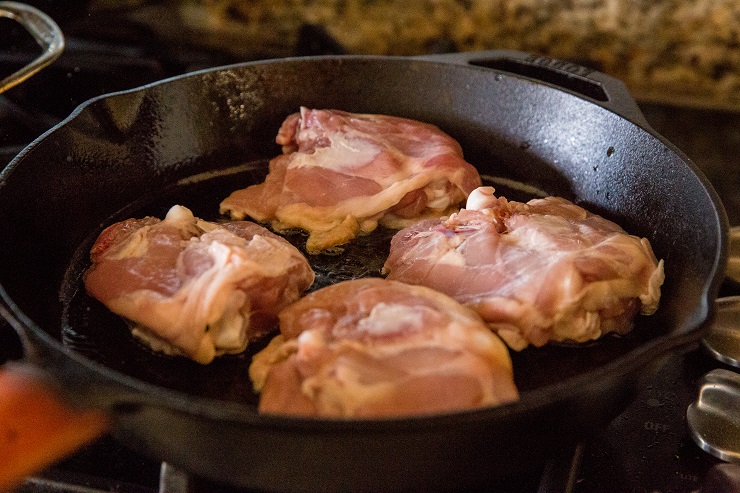 Sear the chicken in cast iron skin-side down