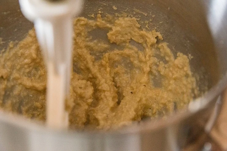 Cream together the butter and sugar in a mixer until creamy