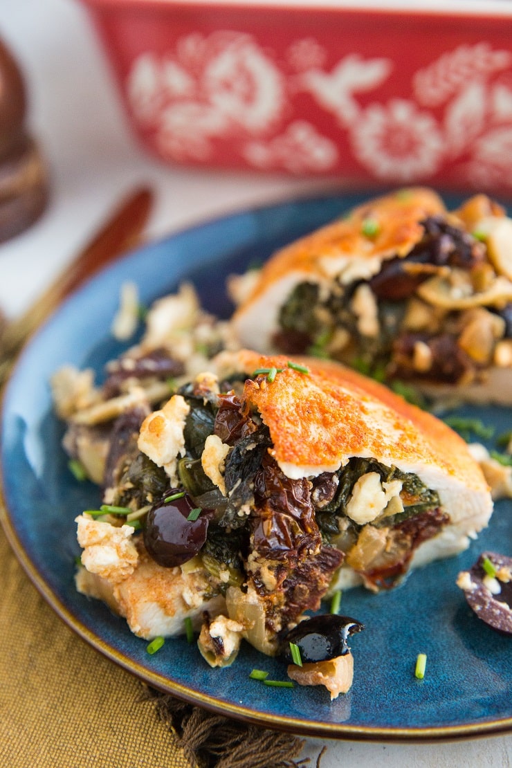 Mediterranean Stuffed Chicken Breasts with sun-dried tomatoes, spinach, feta, kalamata olives, artichoke hearts, and more.