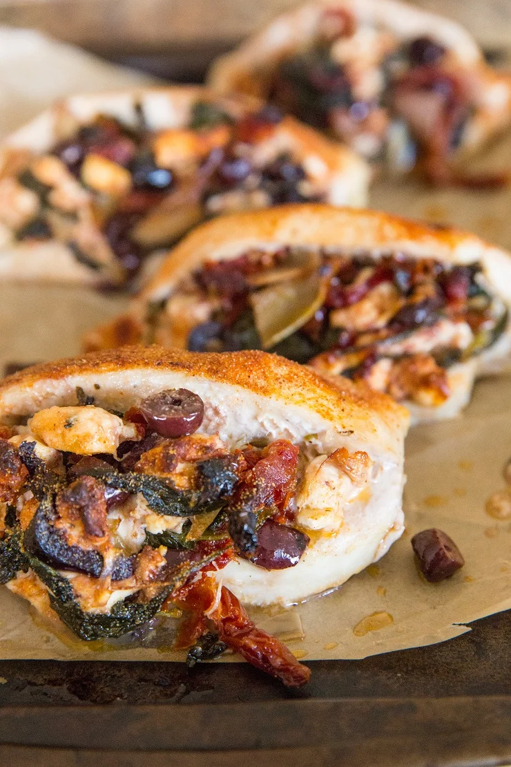 Mediterranean Stuffed Chicken Breasts with spinach, sun-dried tomato, kalamata olives, artichoke hearts, and onion. A flavorful chicken recipe that is easy to prepare.