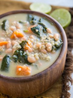 Creamy Vegan Sweet Potato and Quinoa Stew with white beans and spinach. An easy, filling meatless soup recipe