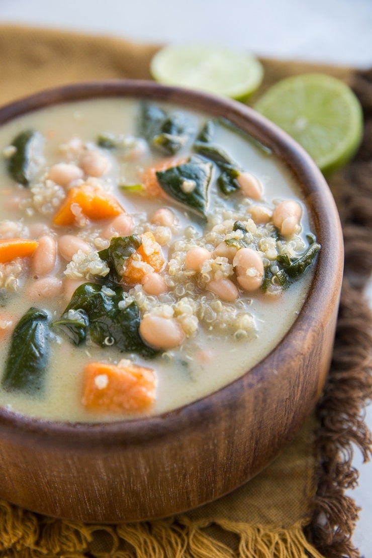 Creamy Vegan Sweet Potato and Quinoa Stew with white beans and spinach. An easy, filling meatless soup recipe