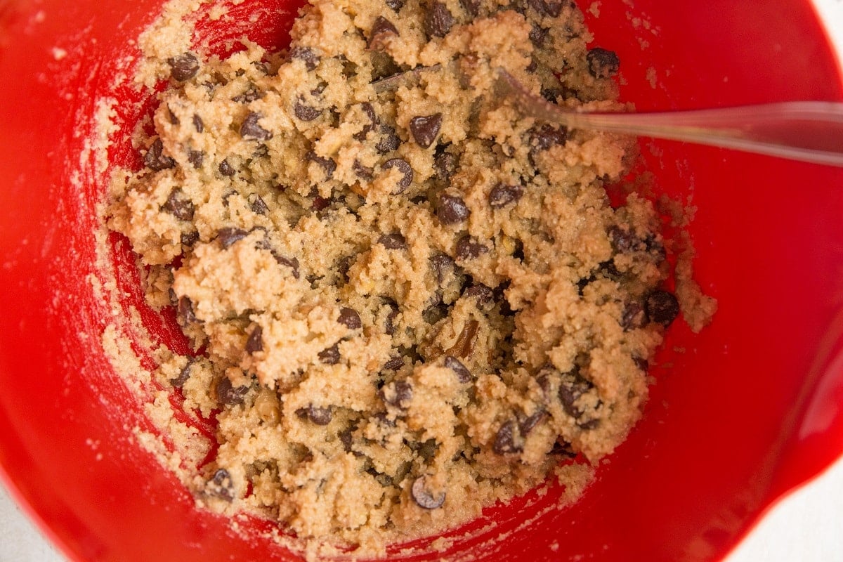 Chocolate chip cookie dough in a mixing bowl
