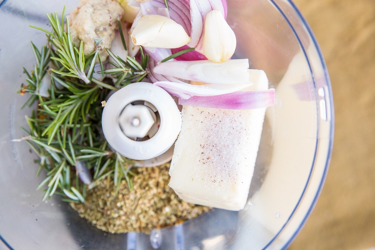 Ingredients for compound butter in a food processor