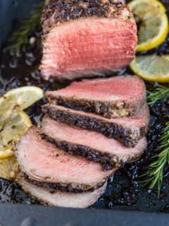 Garlic Herb Roast Beef cooked to perfection. Make a garlic herb compound butter for the ultimate dining experience.