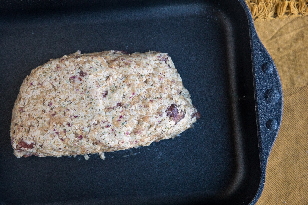 Smear the whole roast with the compound butter and place in a roasting pan