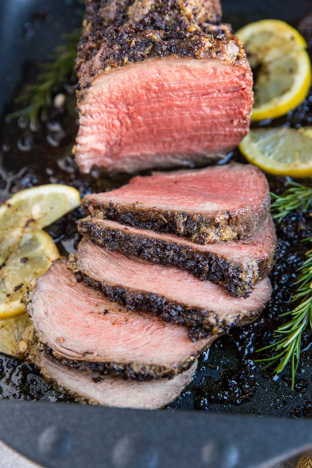 Garlic Herb Roast Beef cooked to perfection. Make a garlic herb compound butter for the ultimate dining experience.