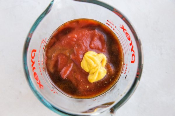 sloppy joe sauce ingredients in a measuring cup