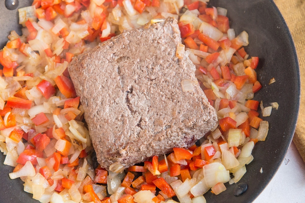 Ground beef in a skillet with vegetables