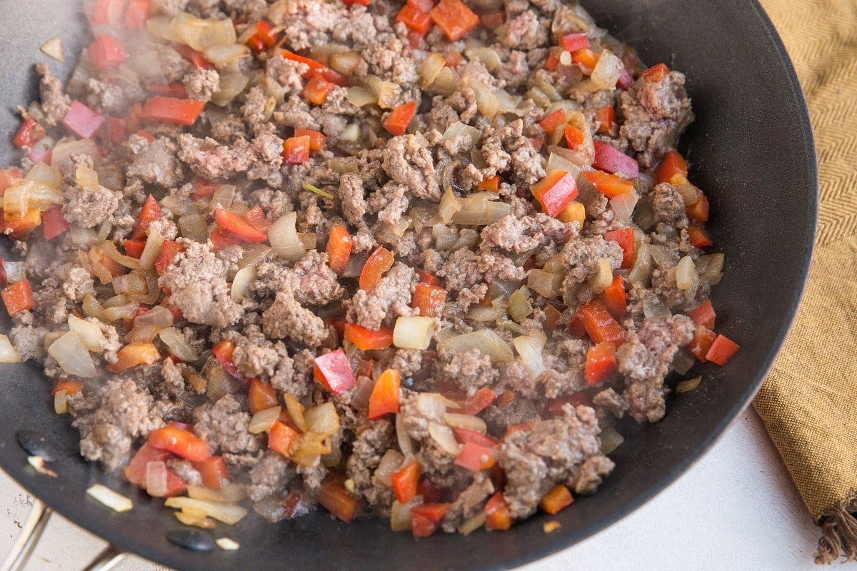 Skillet with ground beef, onion, garlic, and bell pepper