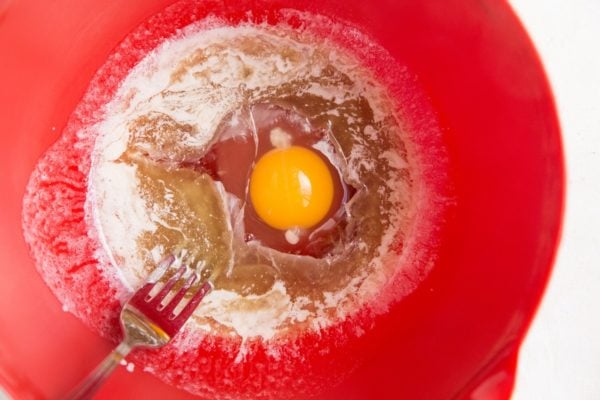 Melted butter, egg, pure maple syrup and vanilla extract in a mixing bowl.