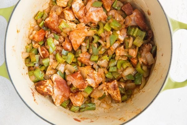 Jambalaya ingredients cooking in a Dutch oven